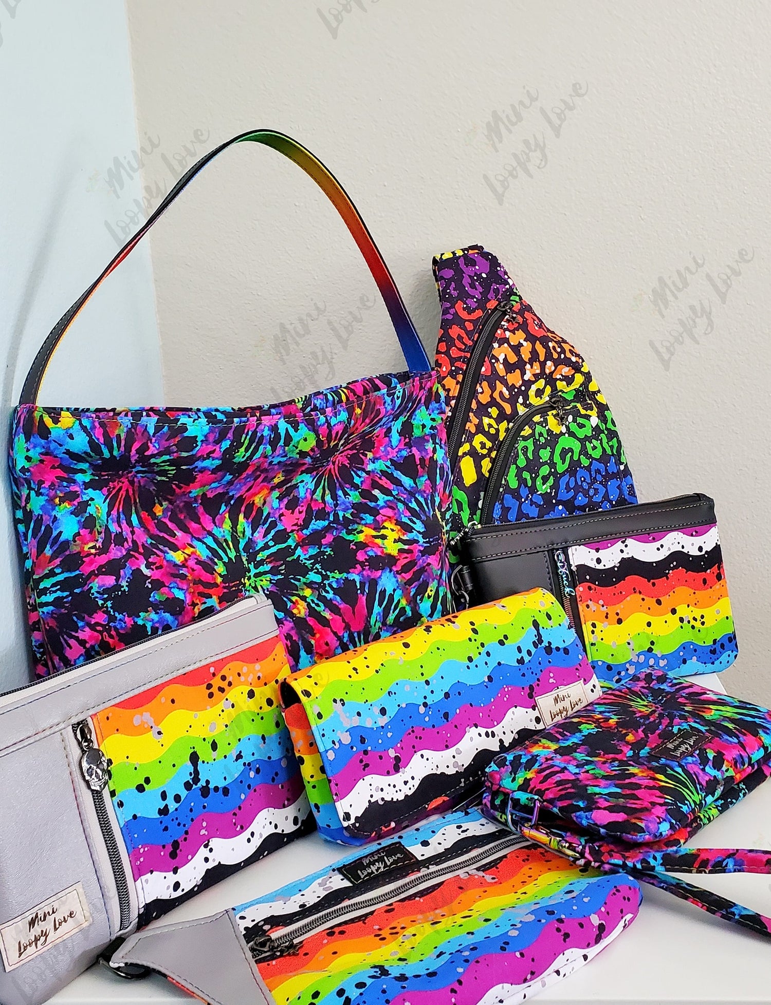 Multiple rainbow bags and wallets